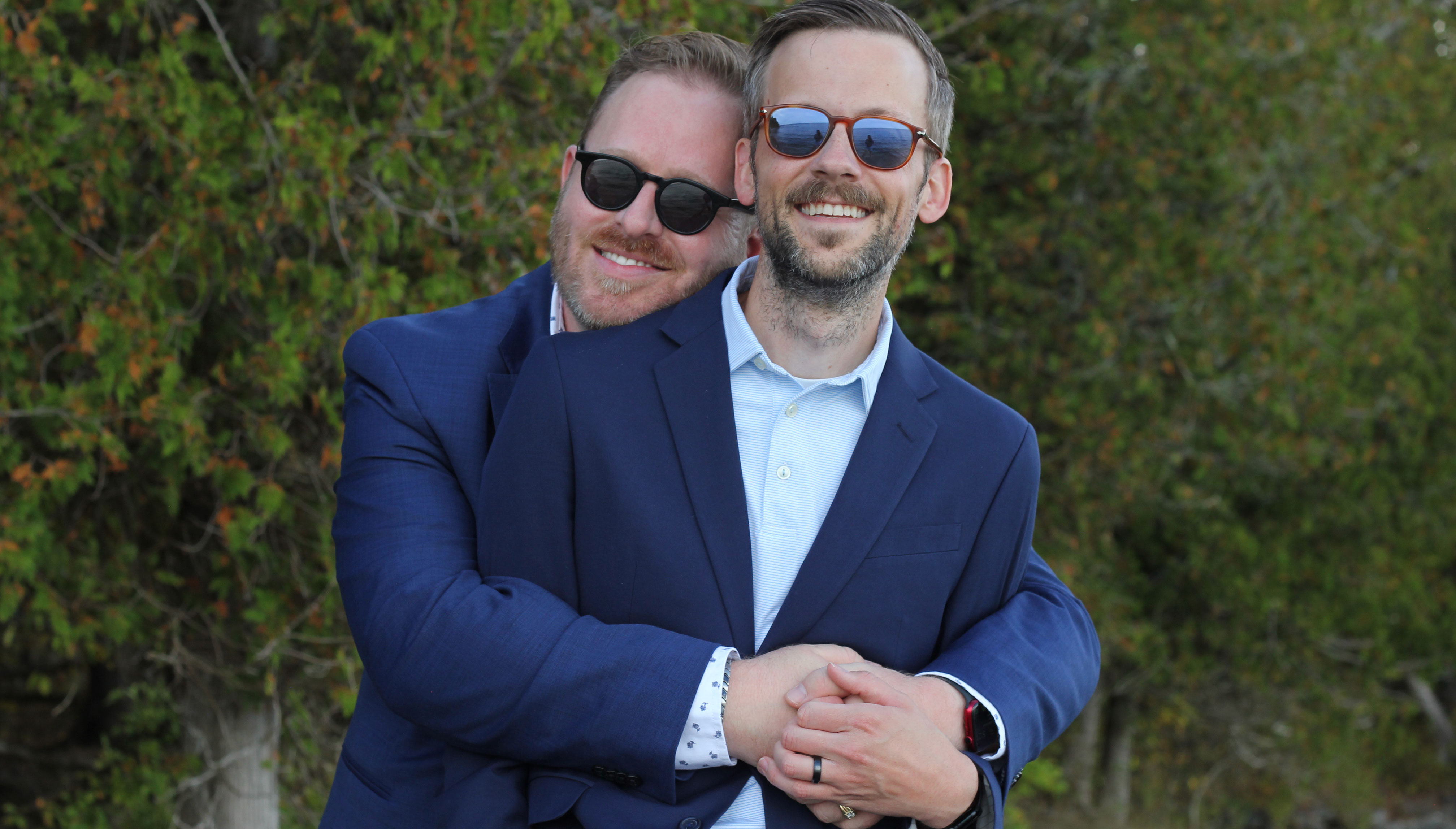 Taylor and Mike's engagement photo, both in sunglasses